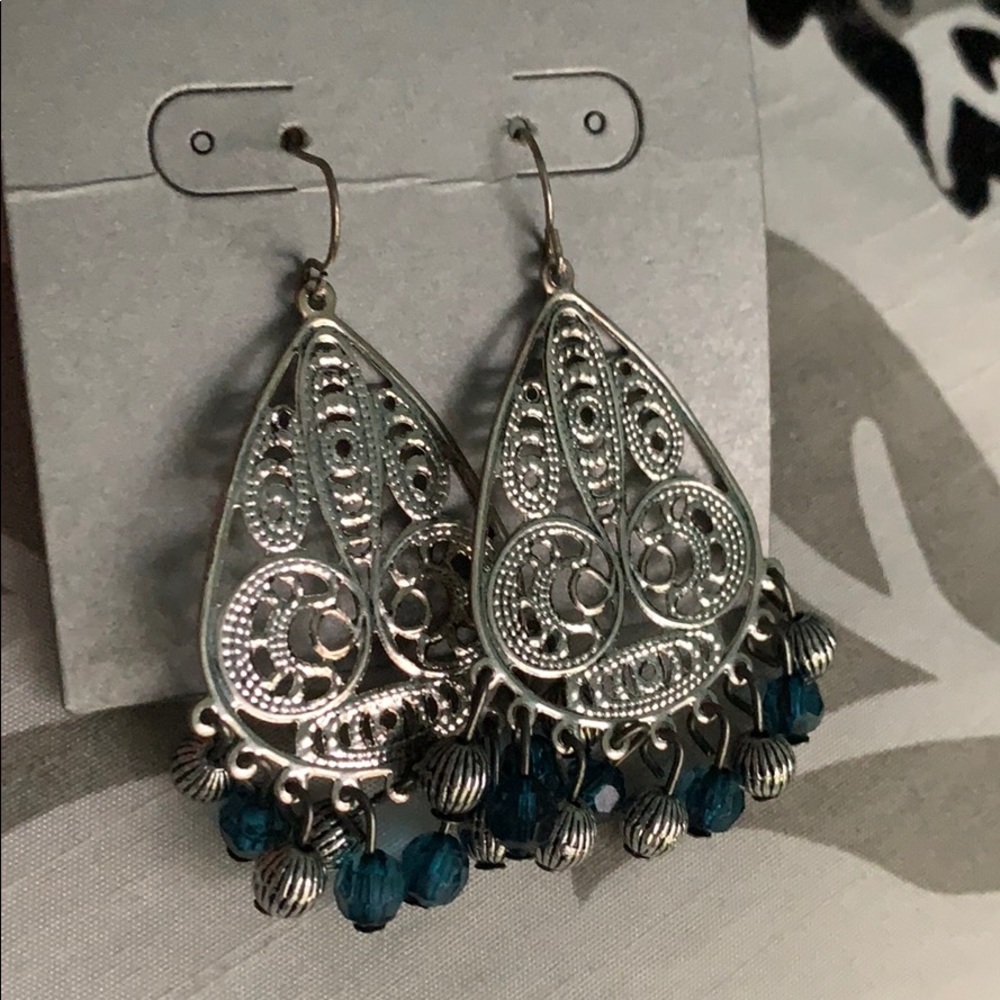 Silver dangle earrings with teal stones
